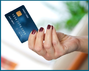 Credit card in woman's hand